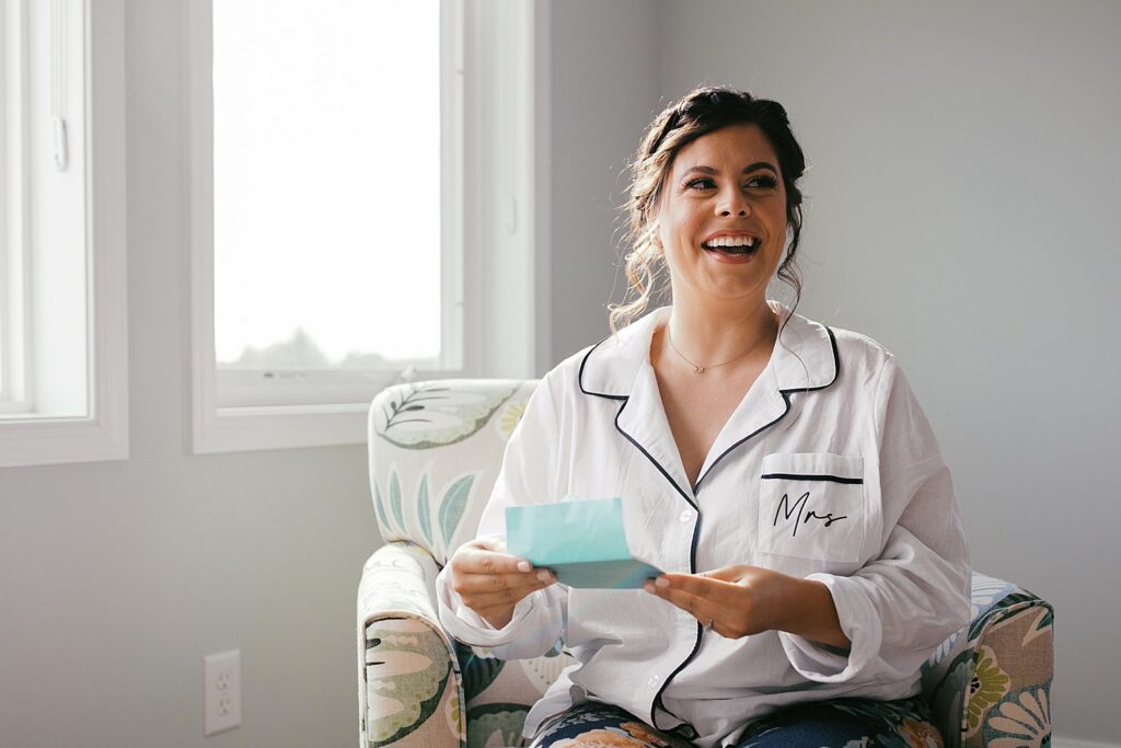 A bride reads a letter from her husband on her wedding day.