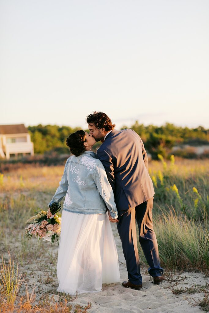 Sunset bride and groom portraits at a Delaware beach wedding.