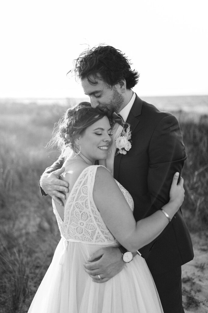 Sunset bride and groom portraits at a Delaware beach wedding.
