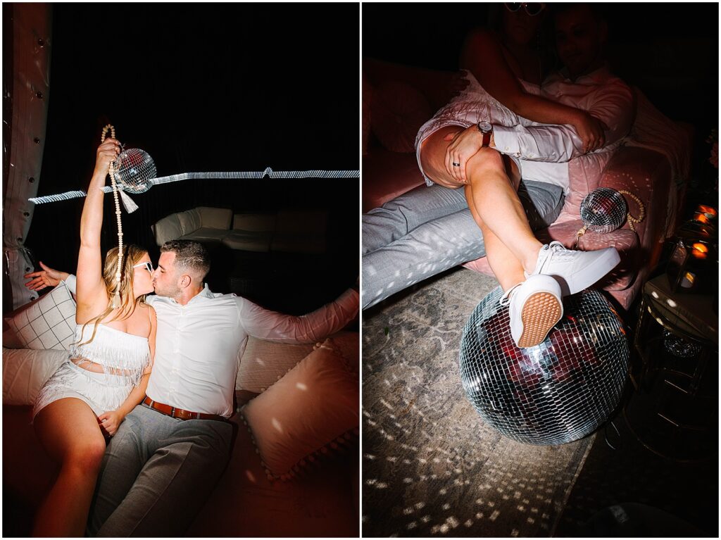 A bride sits on a groom's lap and puts her feet up on a disco ball in a direct flash wedding photo.