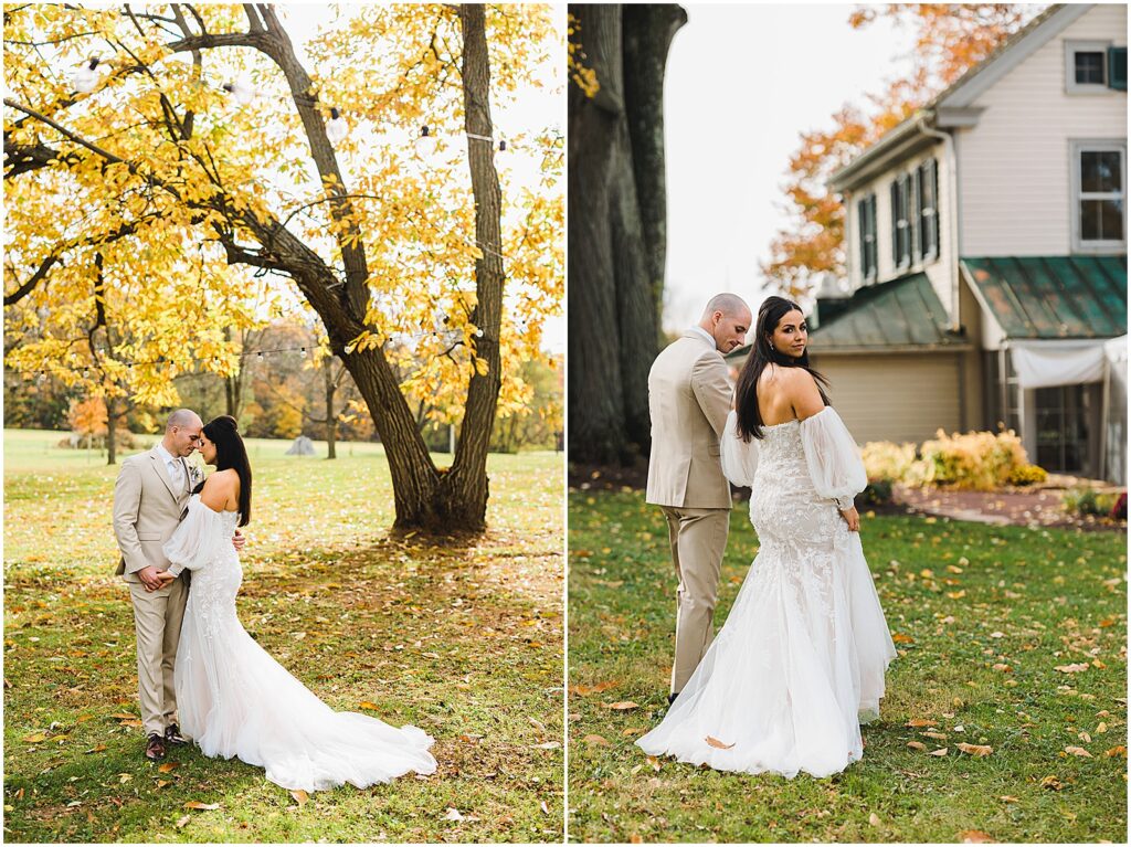 A couple walks towards a white house at an outdoor wedding venue.