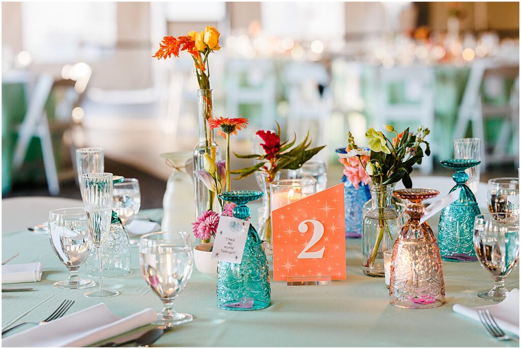 Colorful wedding details decorate a reception table at a New Jersey wedding.