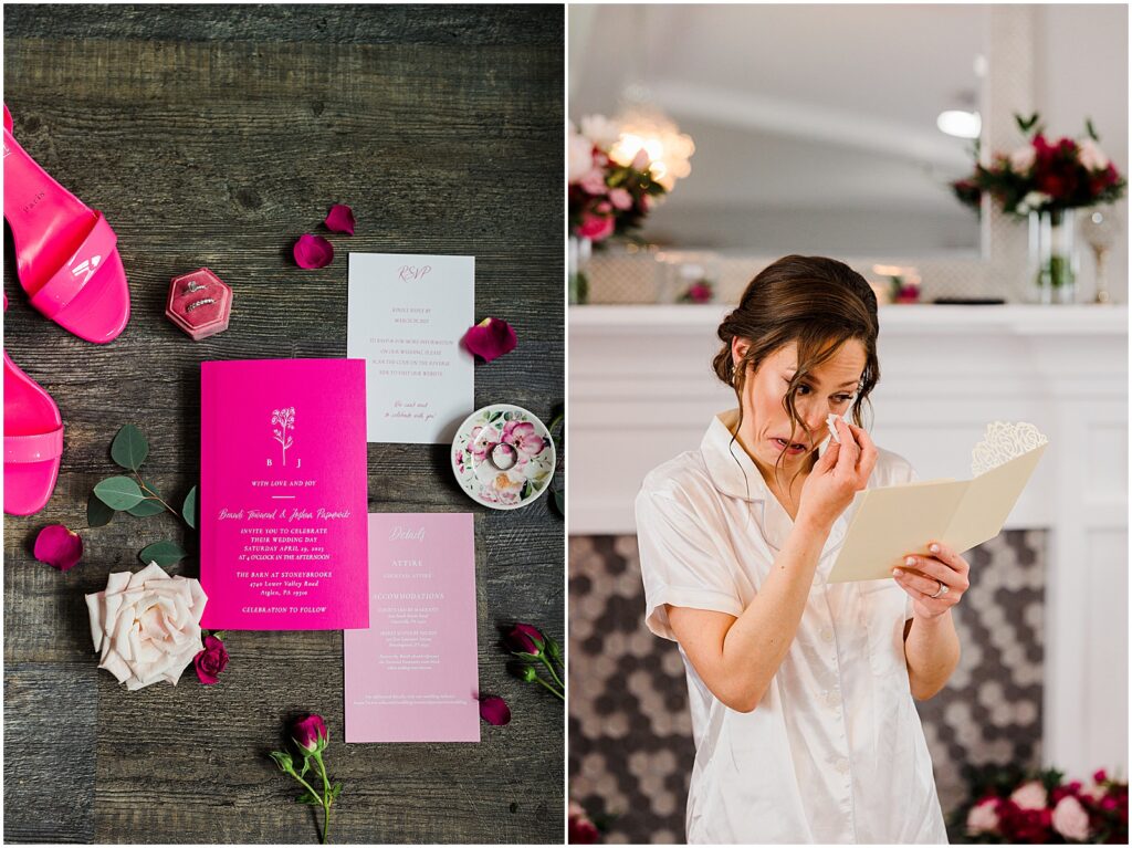 A pink wedding invitation suite sits on a floor surrounded by pink and white wedding flowers.