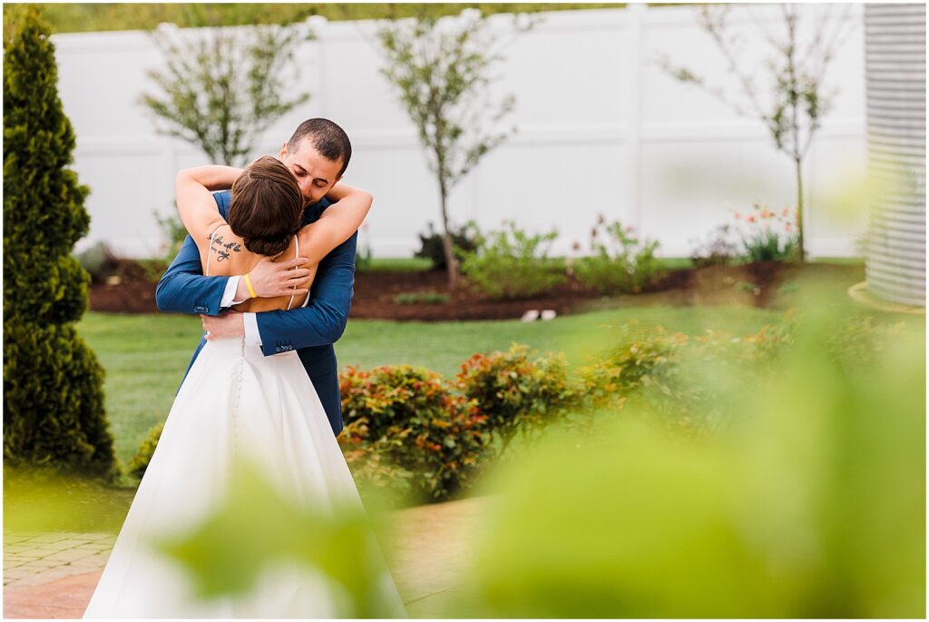 A bride and groom embrace at a Pennsylvania wedding venue.