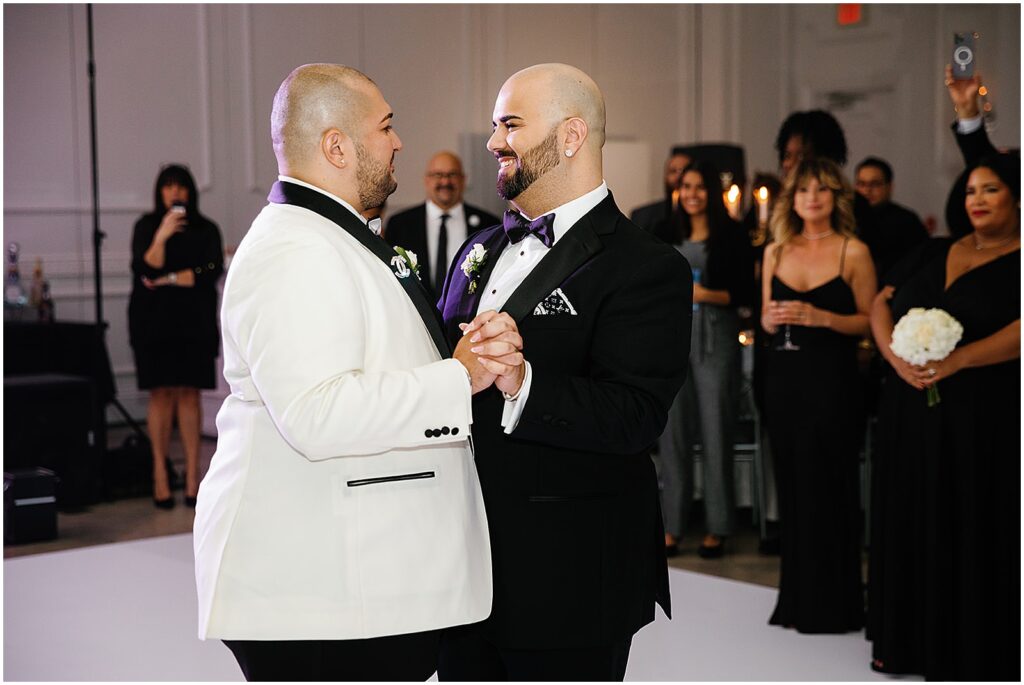 Two grooms share their first dance at the Addison Park.