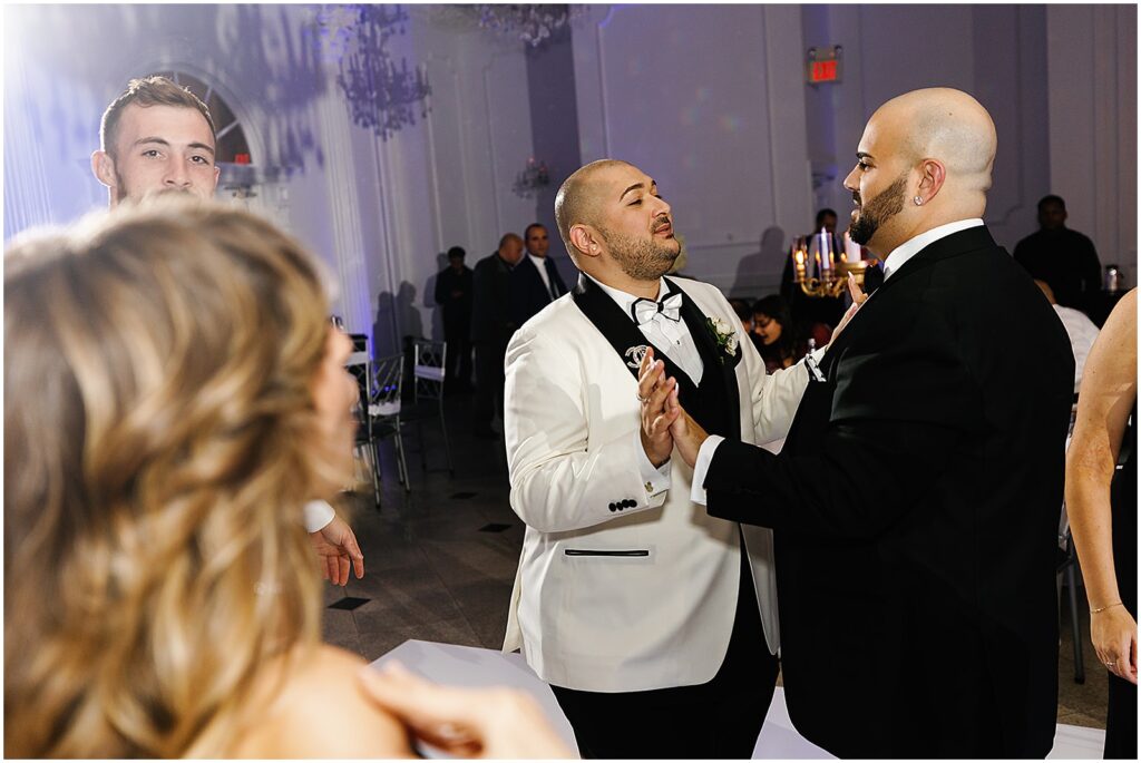 Two grooms dance at their New Jersey wedding.