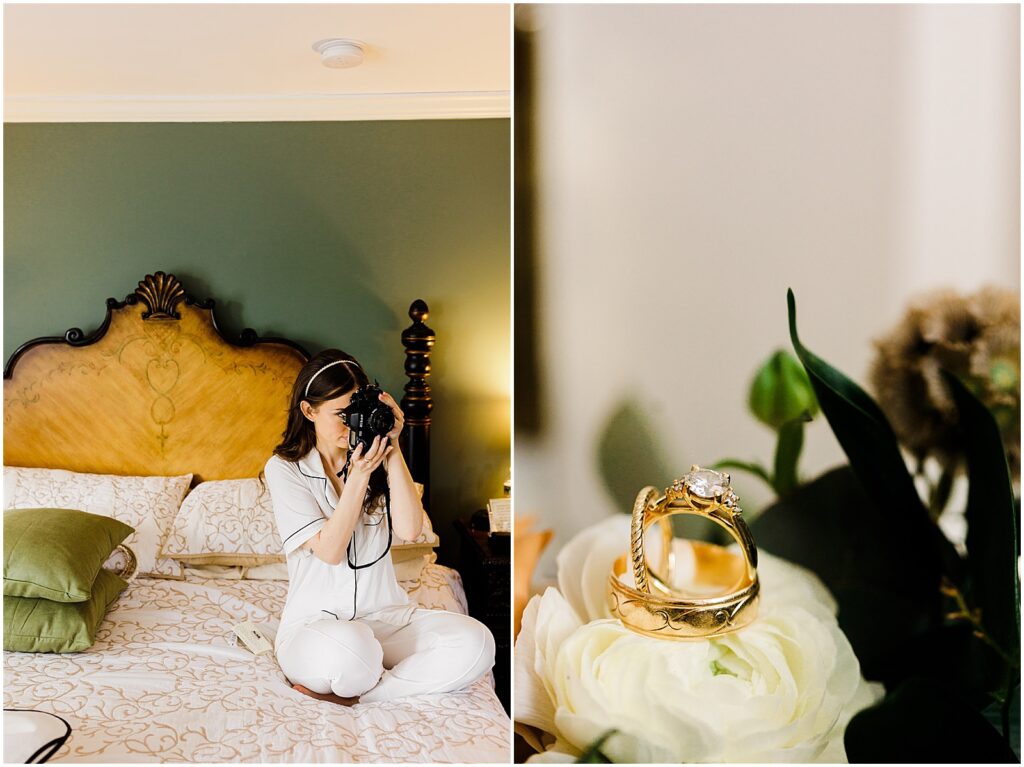 A bride sits on a bed and holds up a vintage camera.