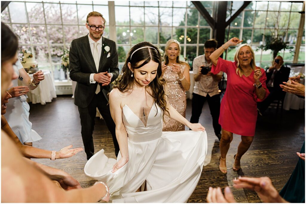 A bride dances surrounded by wedding guests at a New Jersey wedding.