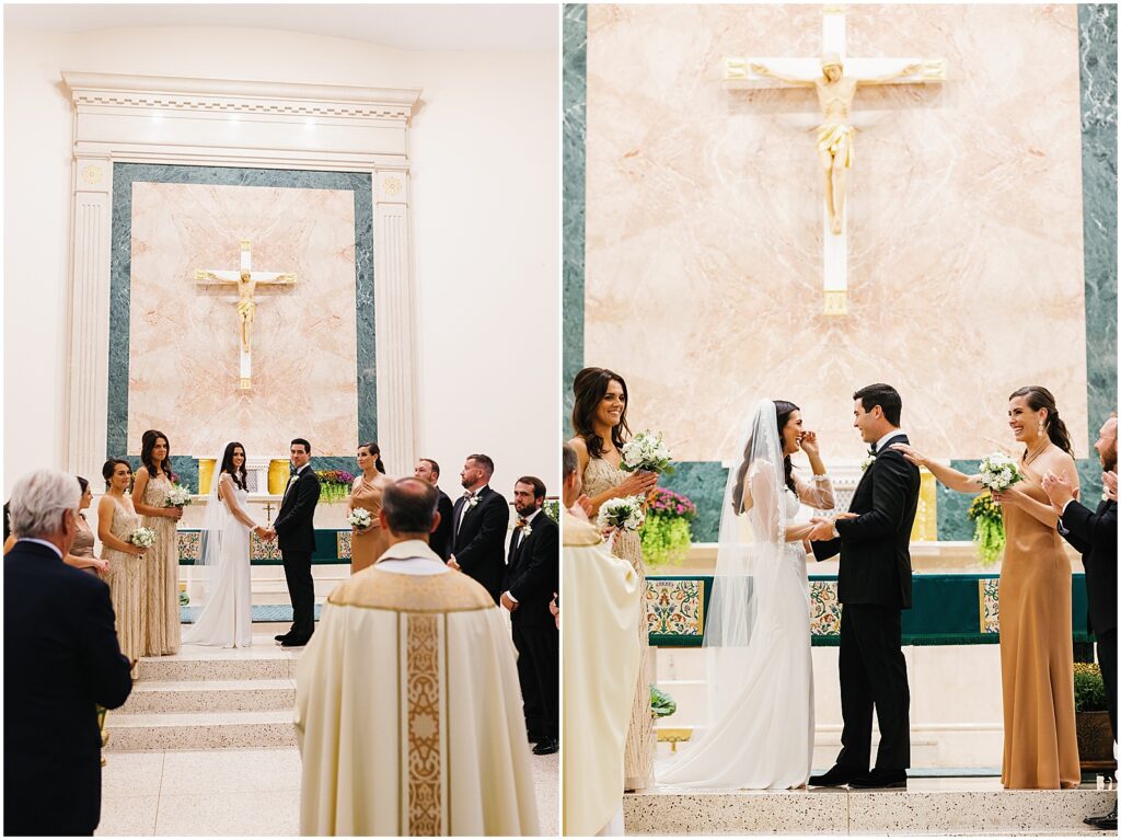 A bride and groom stand at the altar of a Catholic Church wedding.