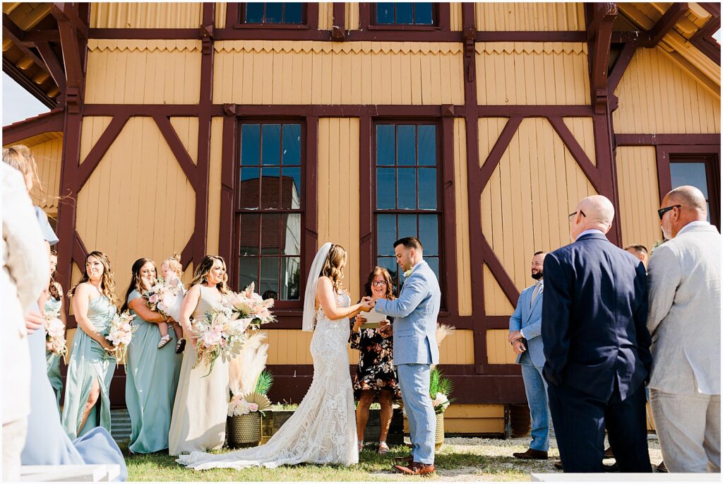 A bride and groom exchange vows at a Delaware wedding.