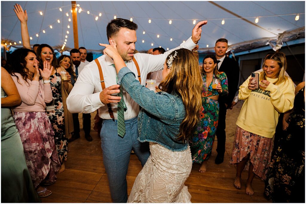 A bride and groom dance at the reception for their Indian River Lifesaving Station wedding.
