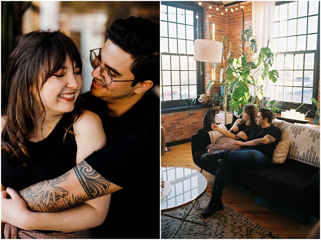 A husband and wife cuddle on a couch in an industrial apartment.