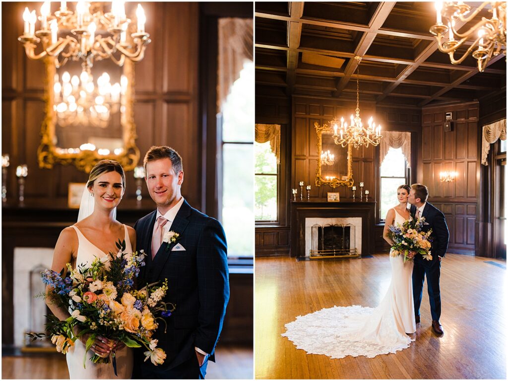 A bride and groom pose beneath a chandelier in a historic wedding venue in Delaware.