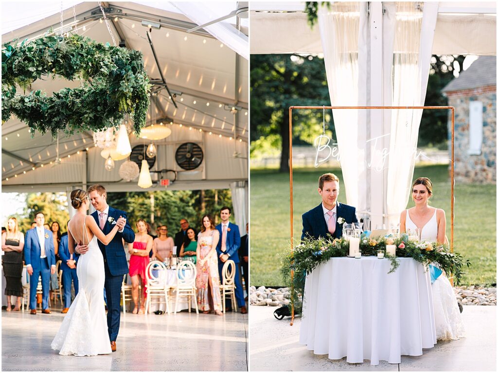 A bride and groom sit at a sweetheart table at their outdoor wedding reception at Bellevue Hall.