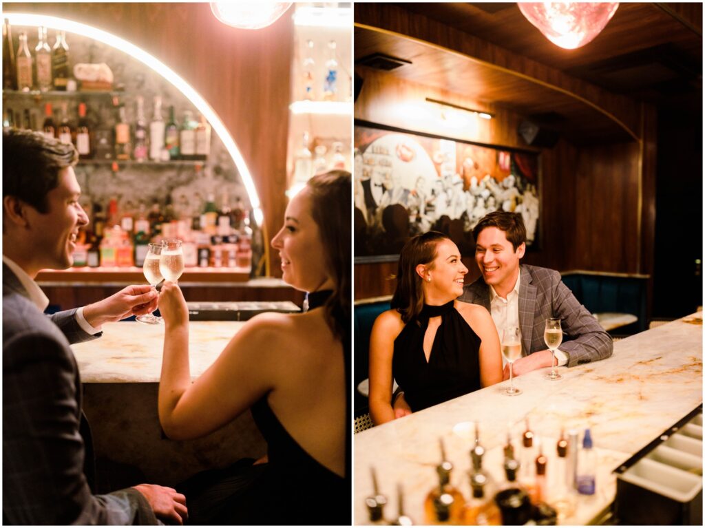 A man and woman sit in a Manhattan bar with flutes of champagne during an engagement session.