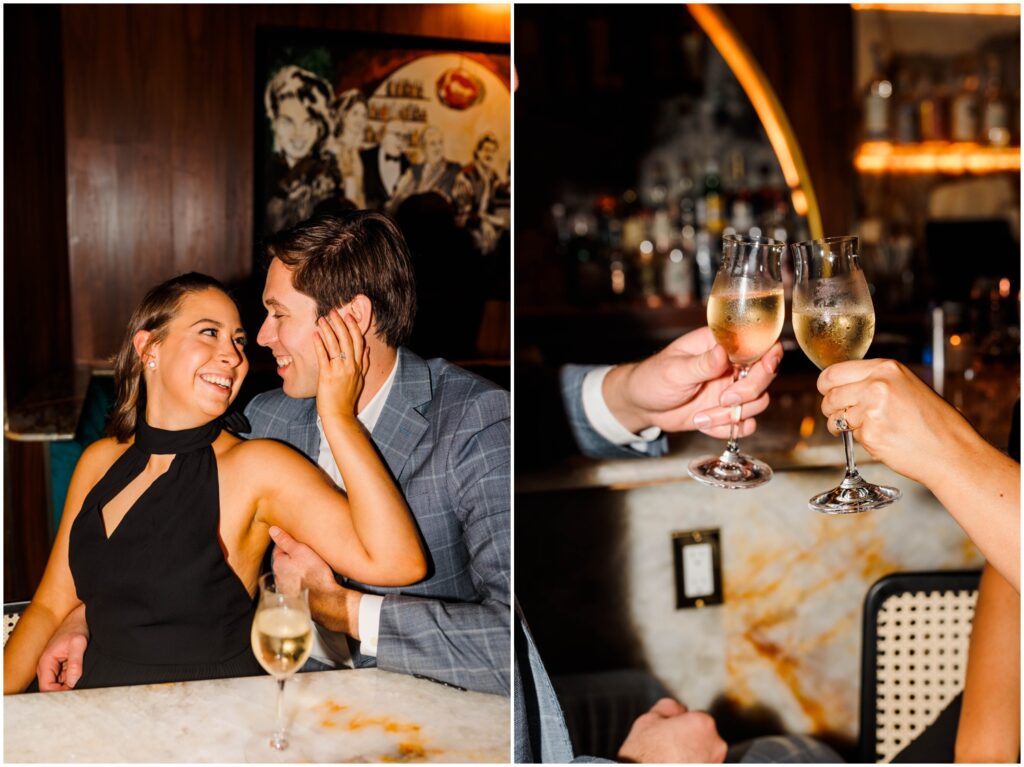 An engaged man and woman toast with champagne in a New York City bar.