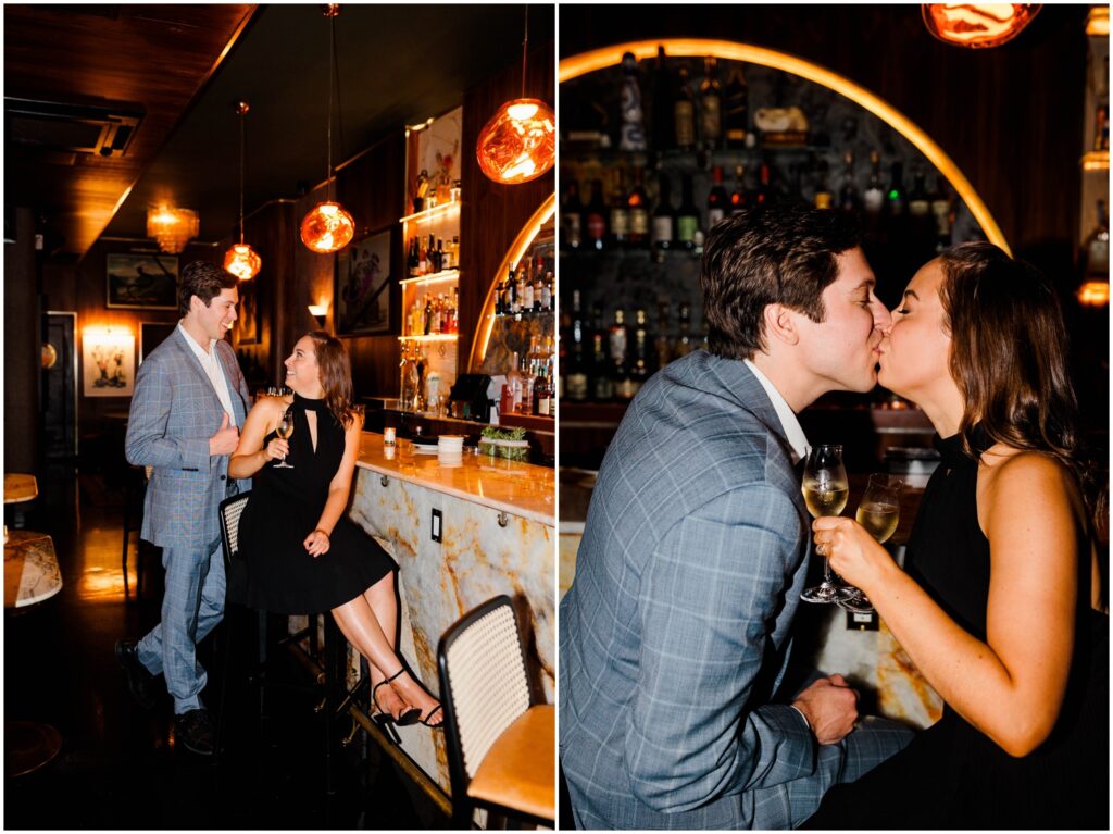 A man kisses a woman sitting on a bar stool in New York City engagement photos.