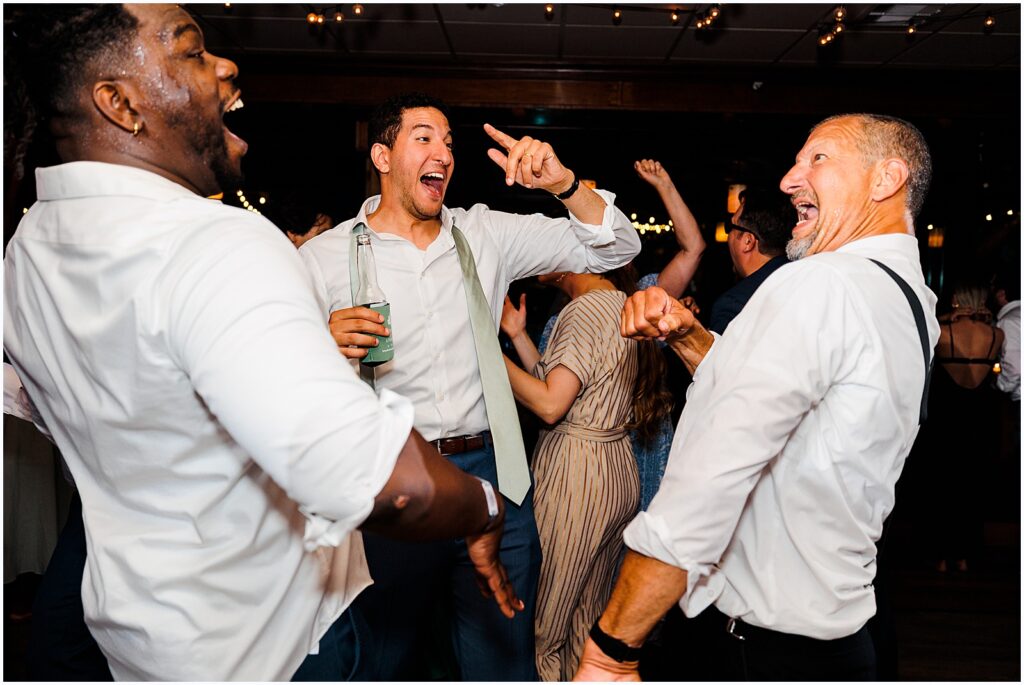 A groom and his friends sing along to a song.
