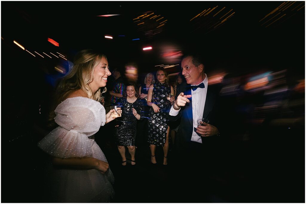 A bride dances with her father.