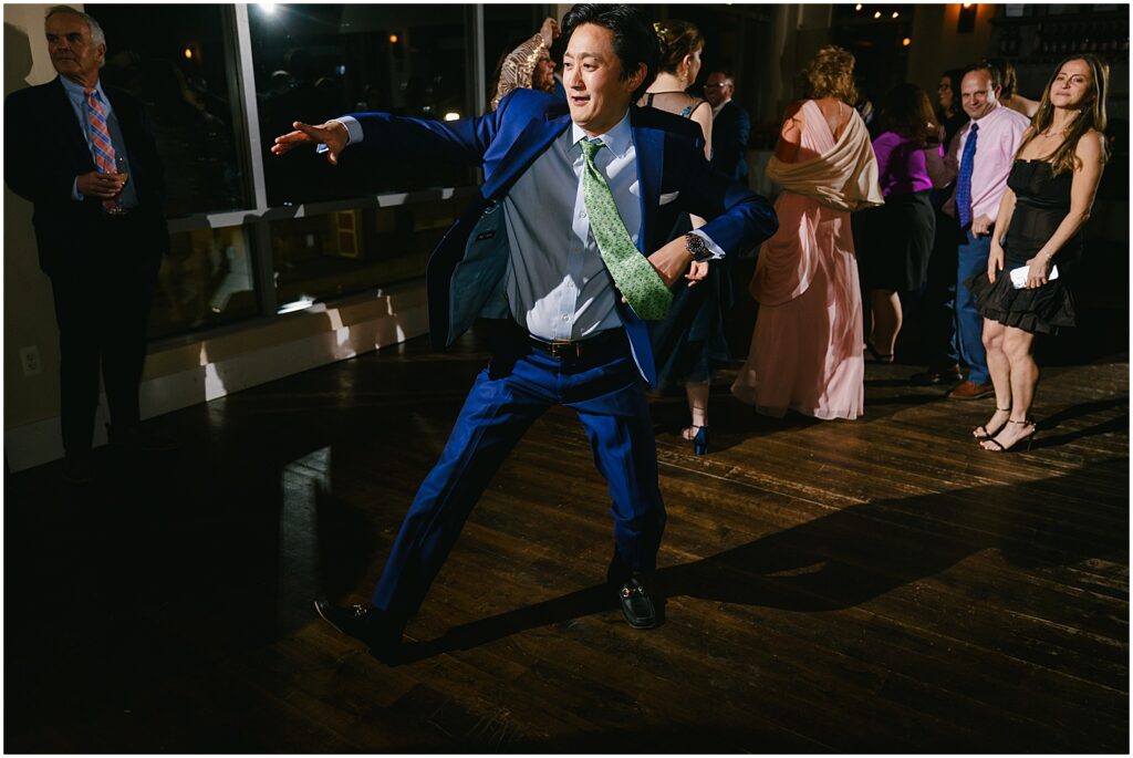 A wedding guest dances across Watermark Asbury Park.
