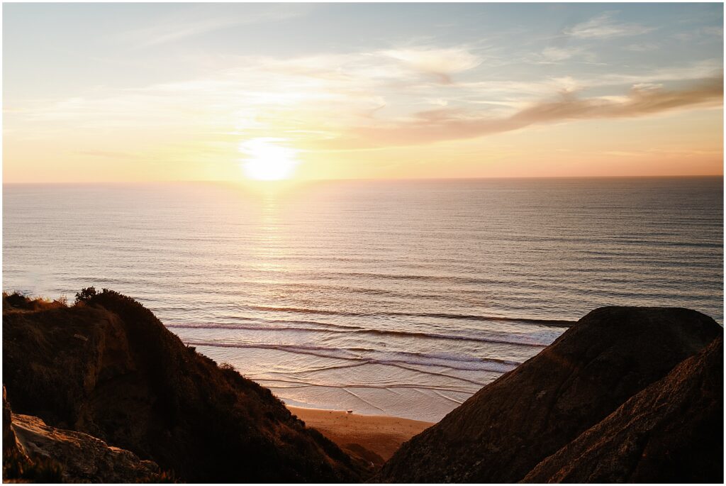 The sun sets over the Pacific Ocean at Black Beach.