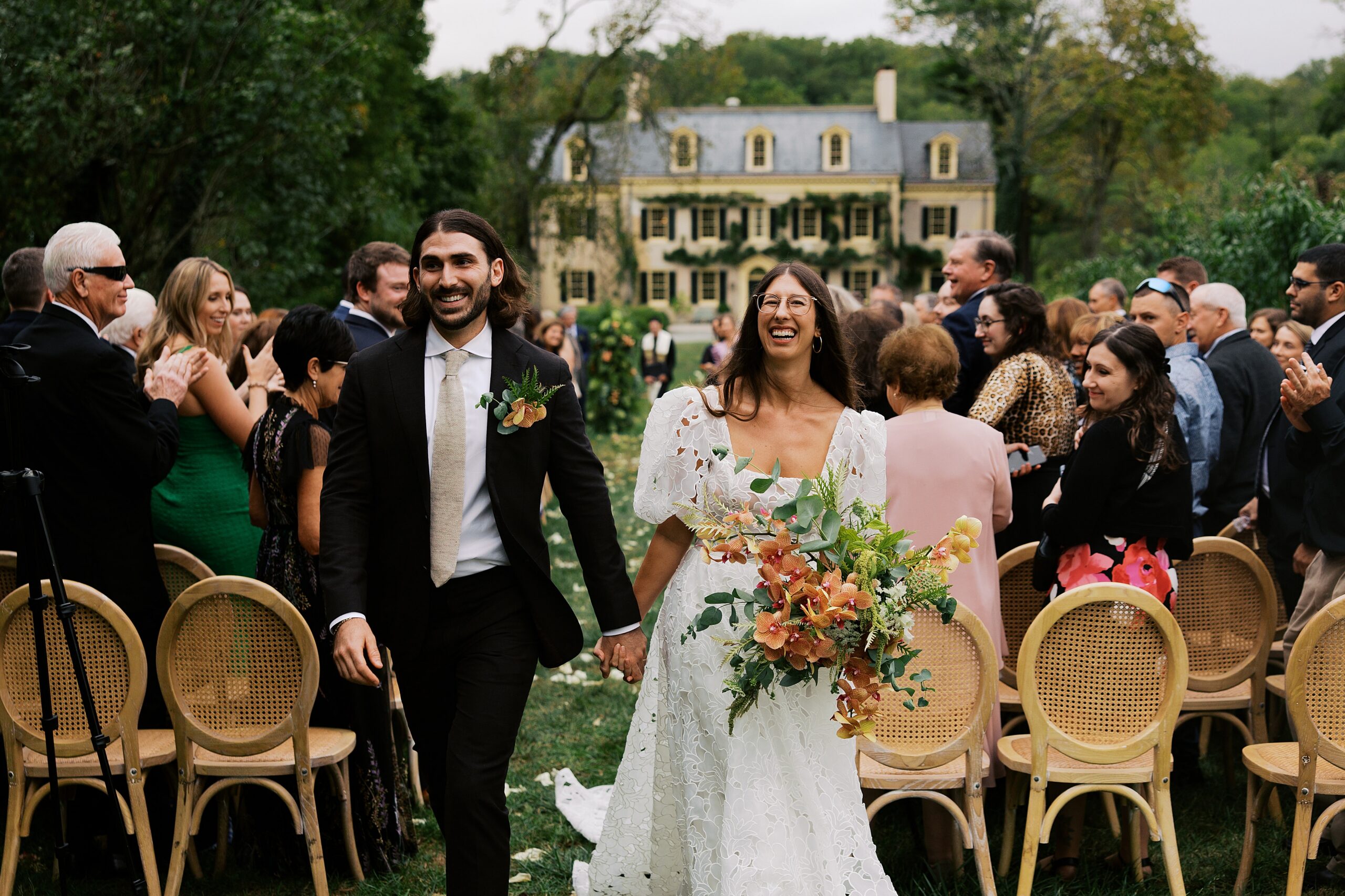 A couple recessing down the aisle at a Wilmington Delaware wedding venue.